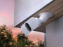 A floodlight camera mounted on a ceiling adapter