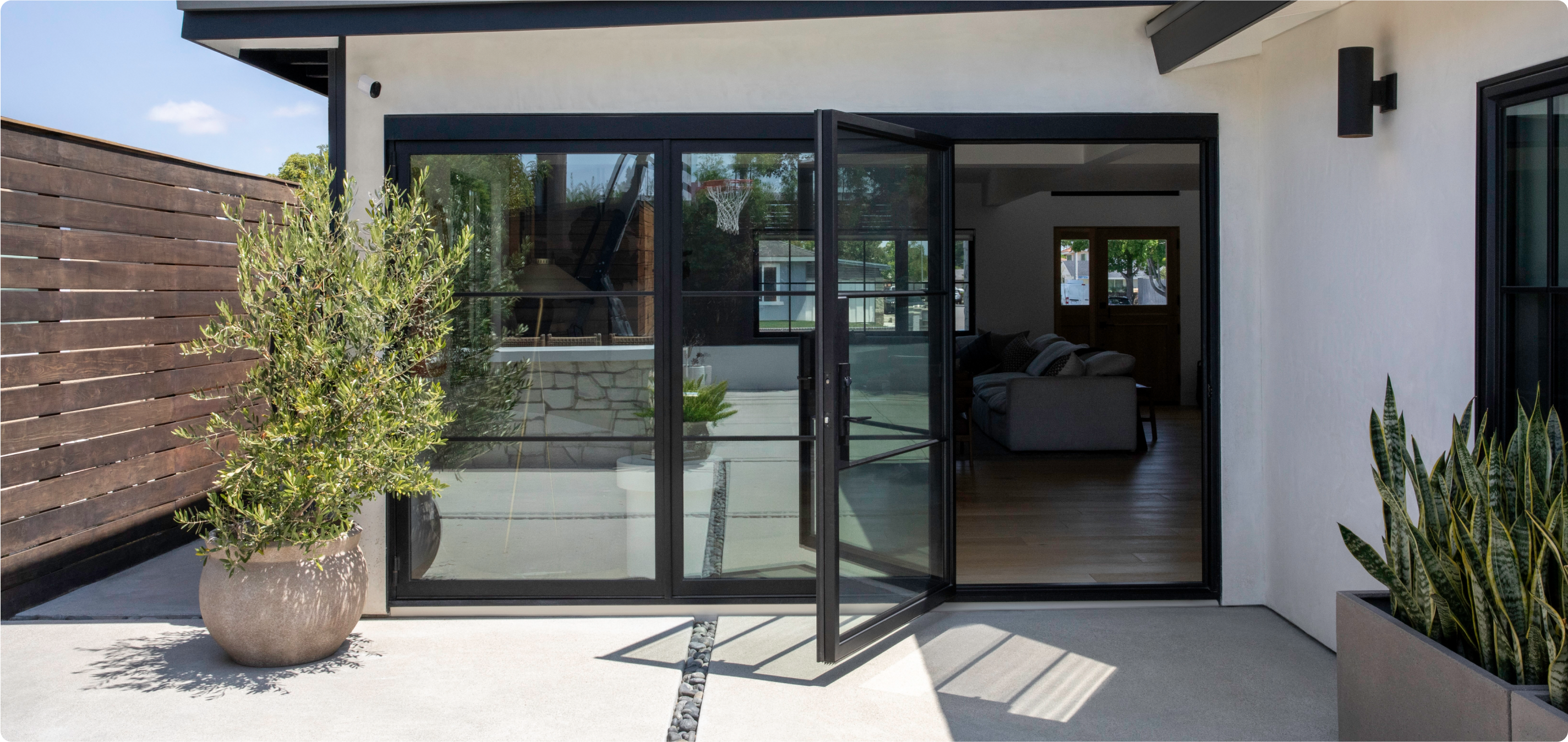Aro Pro 6 XL camera mounted above sliding glass door on house