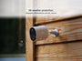 Arlo Go 2 camera mounted on the side of a cabin in the rain