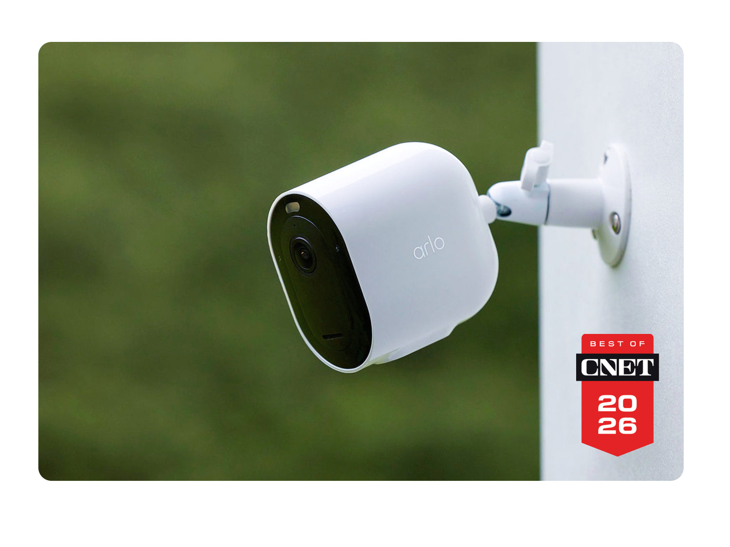 Arlo Pro Security Camera (6th Gen) mounted on a pole with a blurred green background